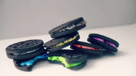 Colorful Oreo cookies with vibrant cream fillings displayed as a food-themed HD PC desktop wallpaper and background.