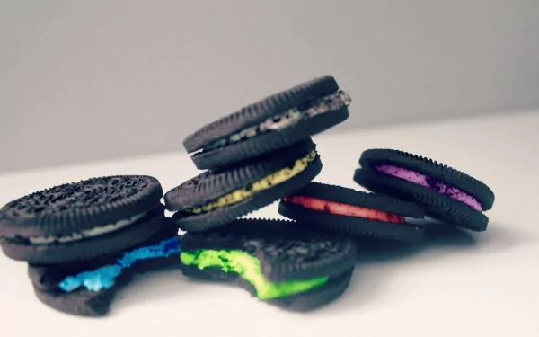 Colorful Oreo cookies with vibrant cream fillings displayed as a food-themed HD PC desktop wallpaper and background.