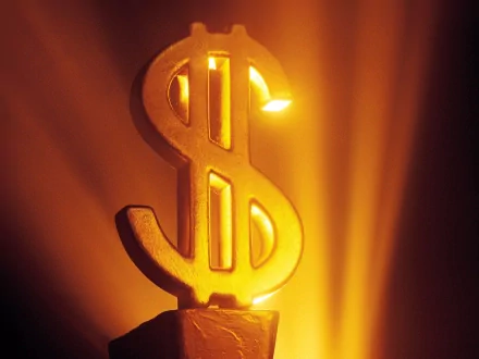 A striking HD desktop wallpaper featuring a glowing gold dollar sign, illuminated against a warm, radiant background, embodying themes of wealth and prosperity.