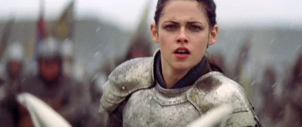 Kristen Stewart as Snow White in armor from the movie Snow White and the Huntsman, featured in a high-definition PC desktop wallpaper.