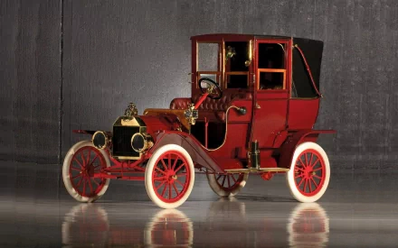 A vintage Ford car showcasing classic design, featuring elegant details and a striking red color. This HD desktop wallpaper captures the charm of early automotive history.