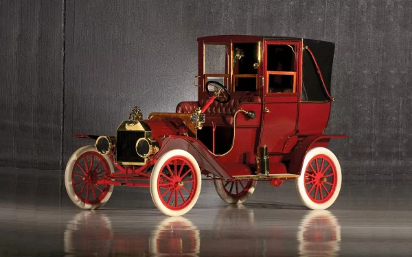 A vintage Ford car showcasing classic design, featuring elegant details and a striking red color. This HD desktop wallpaper captures the charm of early automotive history.