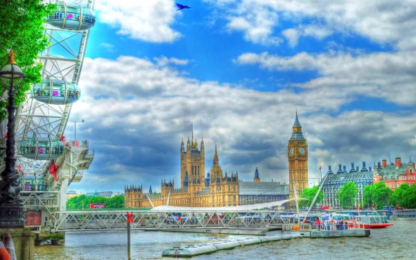 A vibrant HDR view of the London Eye by the River Thames, showcasing Big Ben and the Houses of Parliament against a dramatic sky, capturing the essence of London, England.