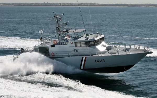 A powerful coast guard vessel navigates through turbulent waters, showcasing the strength and dedication of military sea operations in this high-definition desktop wallpaper.