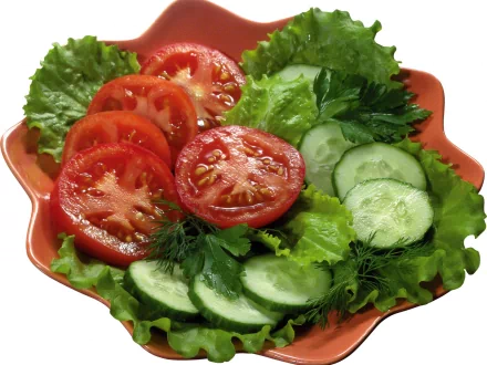 HD PC desktop wallpaper featuring a fresh salad with sliced tomatoes, cucumbers, and leafy greens on an orange plate.