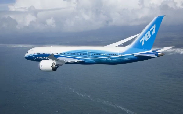 HD desktop wallpaper featuring a Boeing 787 Dreamliner airplane flying over the ocean with a cloudy sky background.