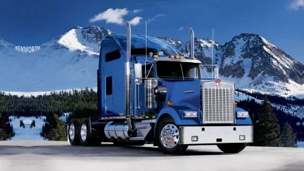 A striking Kenworth truck is showcased against a stunning mountain backdrop, creating a captivating HD desktop wallpaper and background.