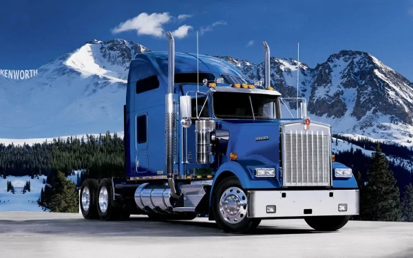 A striking Kenworth truck is showcased against a stunning mountain backdrop, creating a captivating HD desktop wallpaper and background.
