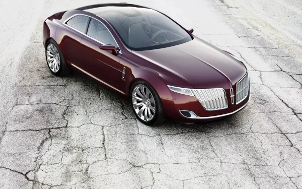 HD PC desktop wallpaper showcasing a sleek maroon Lincoln vehicle parked on cracked pavement, highlighting its modern design and reflective surface.