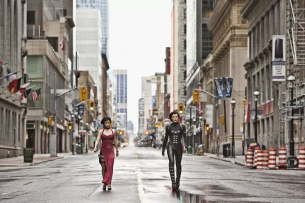 Two women walk down a deserted urban street, embodying the action and intensity of Resident Evil: Retribution, captured in this high-definition PC desktop wallpaper.