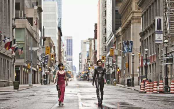 Two women walk down a deserted urban street, embodying the action and intensity of Resident Evil: Retribution, captured in this high-definition PC desktop wallpaper.