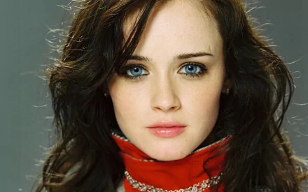 HD desktop wallpaper featuring celebrity Alexis Bledel, showcasing her with a neutral expression, wearing a red scarf and a grey background.