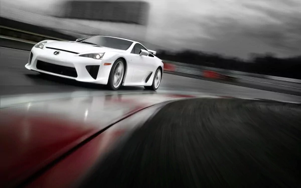 White Lexus LFA Nurburgring Edition speeding through a wet circuit with motion blur — HD PC desktop wallpaper background showcasing the high-performance Lexus LFA.