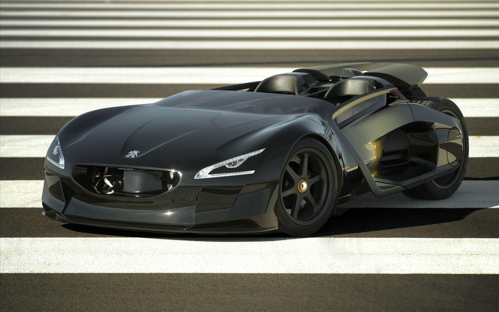 Sleek black Peugeot concept sports car on striped pavement, high-definition PC desktop wallpaper/background.