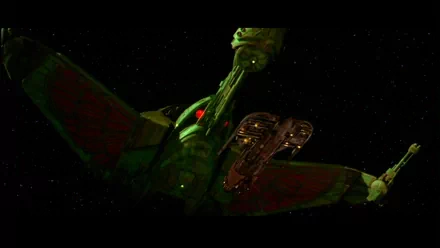 A dramatic scene from Star Trek III: The Search for Spock, featuring a sleek, fictional starship illuminated in vibrant colors against the backdrop of a starry space.