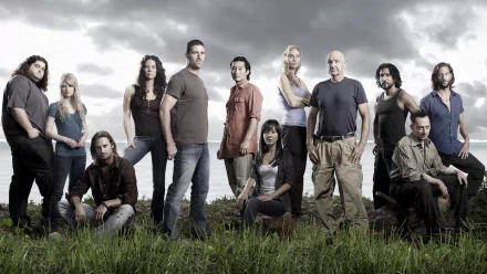 A dramatic ensemble cast from the TV show Lost stands in a grassy area against a moody sky, captured in this HD desktop wallpaper and background.