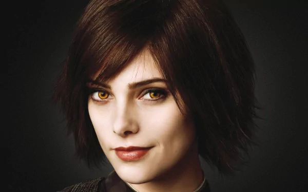 HD desktop wallpaper featuring a character from The Twilight Saga: New Moon, showcasing a close-up of a woman with striking features and golden eyes.
