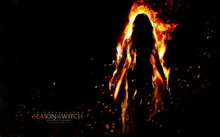 HD PC desktop wallpaper featuring a fiery silhouette from the 2011 movie Season of the Witch, with flames and embers surrounding the dark figure.