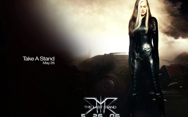 Rogue from Marvel Comics stands in a striking pose in this HD wallpaper for X-Men: The Last Stand, featuring a dramatic backdrop and promotional text.
