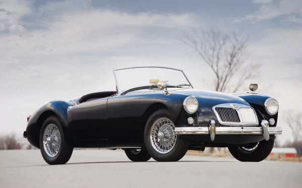 HD PC desktop wallpaper featuring a classic MG convertible vehicle parked on an open road under a cloudy sky.