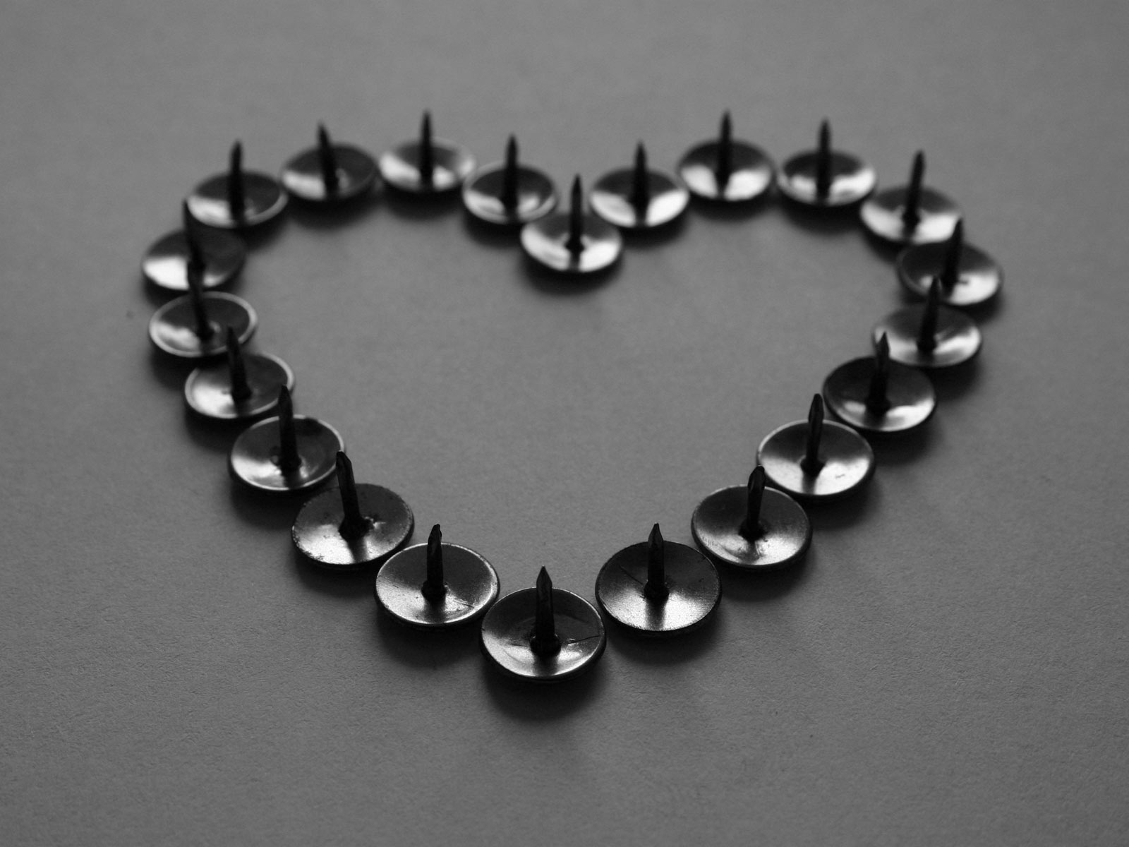 Thumbtacks shaped like a heart