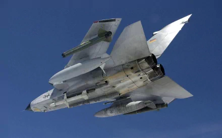 HD PC desktop wallpaper and background: military Panavia Tornado in flight photographed from below against a clear blue sky.