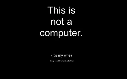 A minimalist HD wallpaper featuring a humorous statement: This is not a computer. (It's my wife). The design is simple, making a fun statement about relationships.
