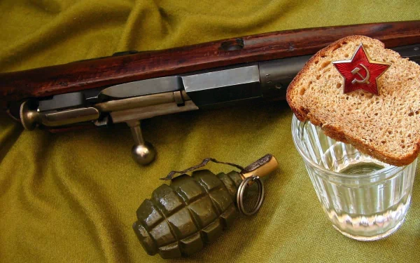 HD desktop wallpaper featuring Russian Army military items: a vintage rifle, a hand grenade, and a glass of water topped with a slice of bread adorned with a Soviet star pin.