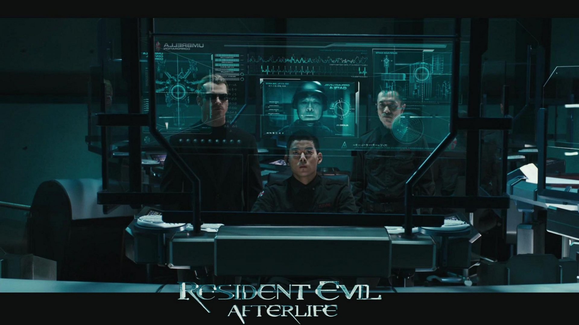 HD PC desktop wallpaper from Resident Evil: Afterlife — a dim command room with four figures around a holographic console, the film logo visible at the bottom.