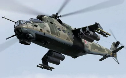 A HD desktop wallpaper featuring a military Mil Mi-24 helicopter in flight, showcasing its aggressive design and formidable armament against a backdrop of clouds.