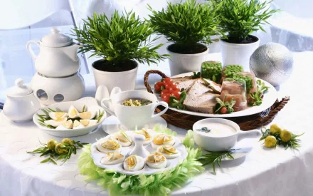 HD desktop wallpaper of a meal featuring deviled eggs, sliced meat, soup, and a teapot, accompanied by green potted plants on a white tablecloth.