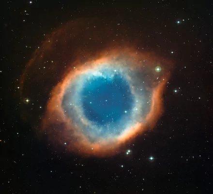 Vivid 4K Ultra HD PC desktop wallpaper showcasing the Helix Nebula with vibrant blue core and surrounding orange-red space clouds, evoking a stunning sci-fi starfield scene.