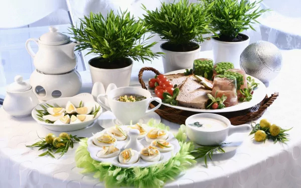 HD desktop wallpaper of a meal featuring deviled eggs, sliced meat, soup, and a teapot, accompanied by green potted plants on a white tablecloth.