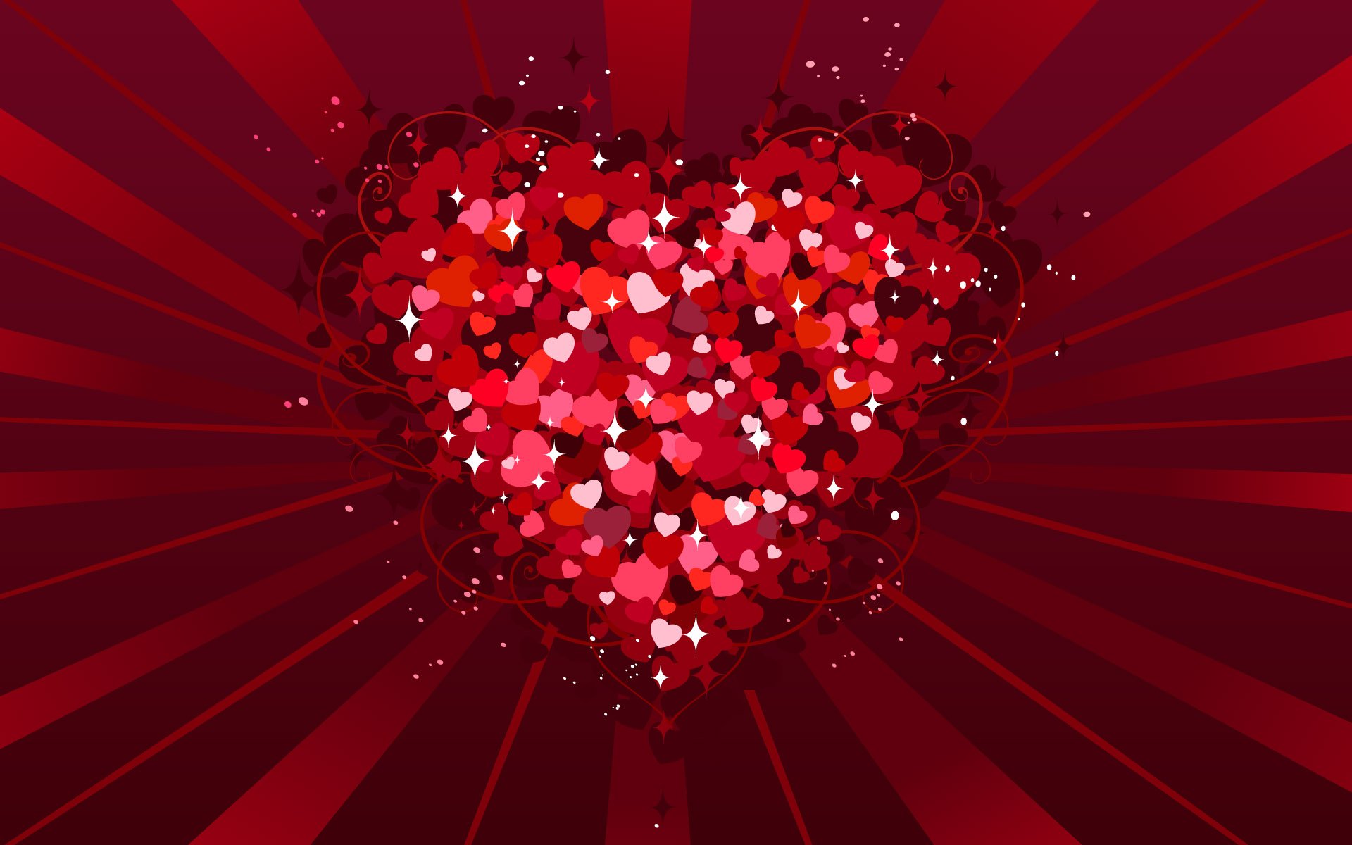 HD PC desktop wallpaper featuring a vibrant red heart made of smaller hearts with radiating rays, celebrating Valentine's Day holiday.