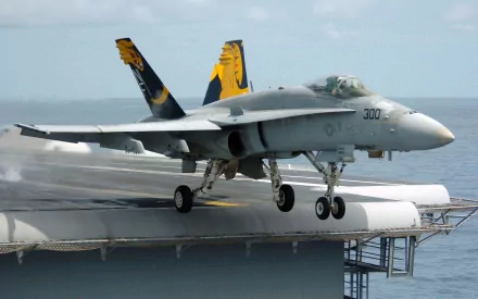 A Boeing F/A-18E/F Super Hornet takes off from an aircraft carrier, showcasing military aviation prowess in a high-definition desktop wallpaper.