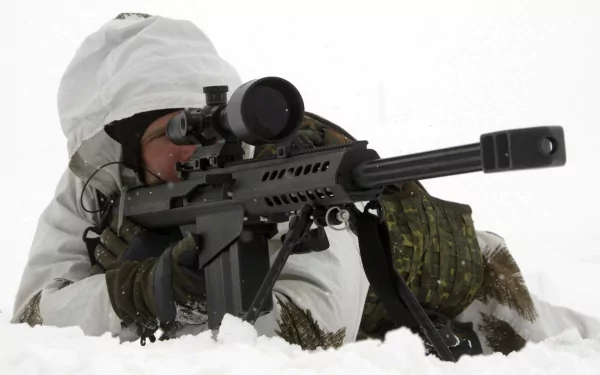 A soldier in winter camouflage aims a sniper rifle while lying in the snow, capturing a moment of military precision in this striking HD desktop wallpaper.