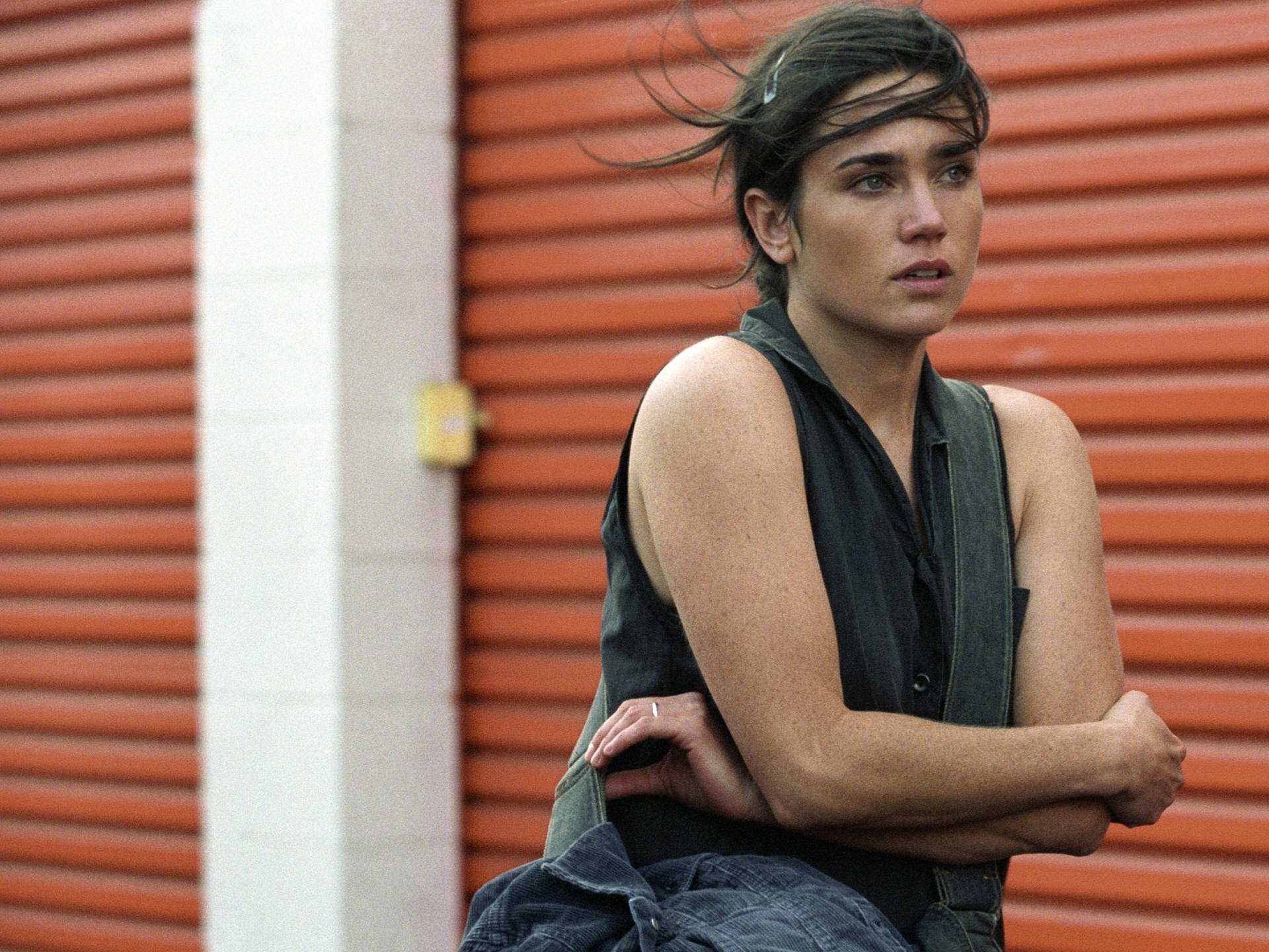 HD PC desktop wallpaper featuring celebrity Jennifer Connelly against an industrial background with red metal doors.