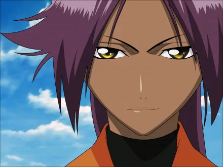 Close-up of Yoruichi Shihôin from the anime Bleach, featured in an HD PC desktop wallpaper with a clear blue sky background.