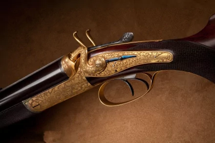 A detailed close-up of an intricately designed shotgun, showcasing its ornate engravings and craftsmanship, set against a rich brown background for a striking HD desktop wallpaper.