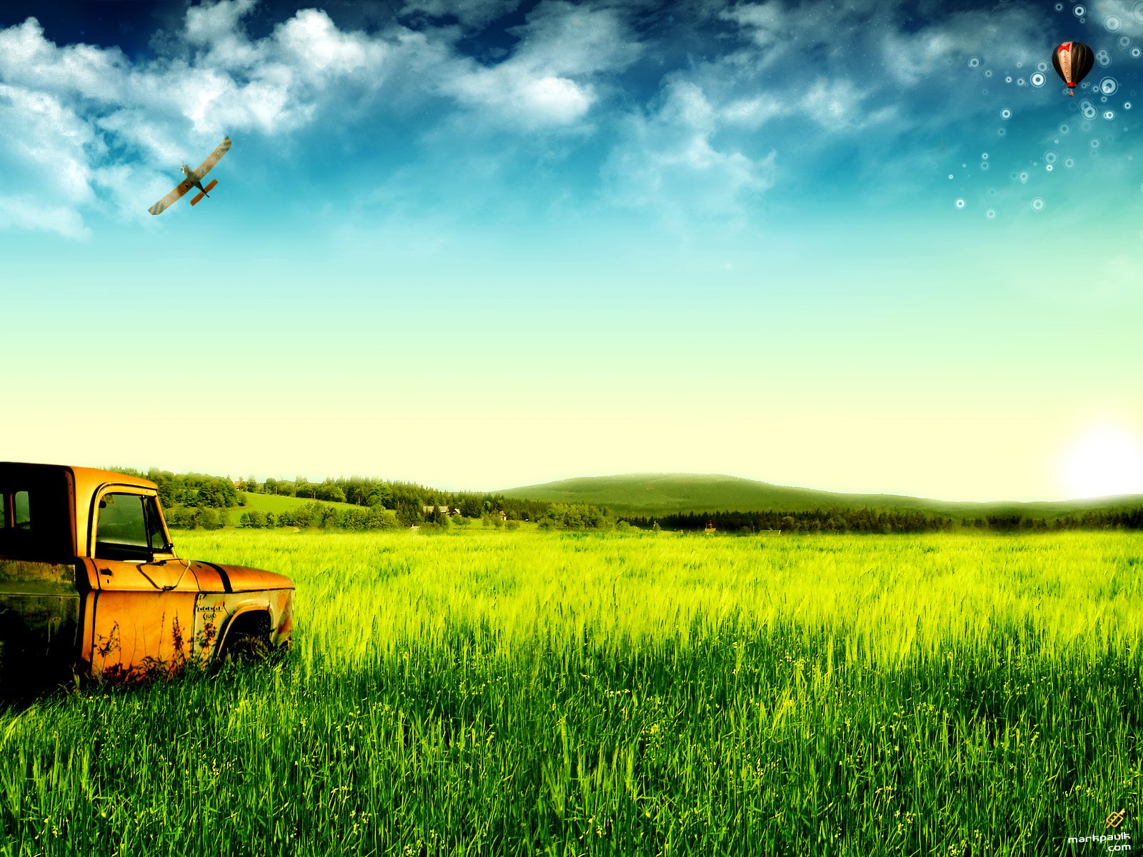 HD PC desktop wallpaper showcasing a dreamy world with a vintage truck in a lush green field under a bright sky and a small airplane flying overhead.