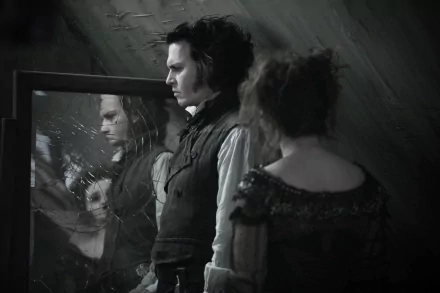 A haunting black-and-white scene from Sweeney Todd: The Demon Barber of Fleet Street in Concert, featuring Johnny Depp and Helena Bonham Carter, set against a reflective mirror backdrop.