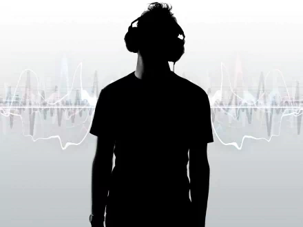 Silhouette of a person wearing headphones with sound waves in the background, featured in a HD desktop wallpaper and background image. Tagged with music and headphones.