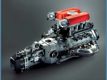 HD wallpaper featuring a Ferrari supercharged engine, highlighting intricate mechanical details against a dark background. The image evokes themes of high-performance engineering, common in vehicles and airplanes.
