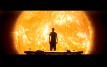 A silhouetted figure stands before a massive, glowing sun in this HD desktop wallpaper inspired by the sci-fi movie Sunshine (2007), evoking themes of space and exploration.