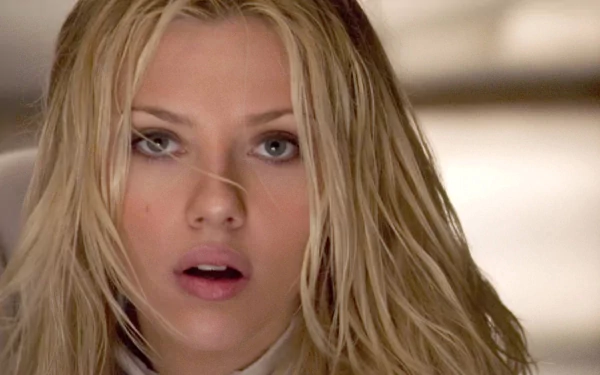 A high-definition desktop wallpaper featuring Scarlett Johansson in a scene from the movie The Island, showcasing her intense expression with soft lighting.