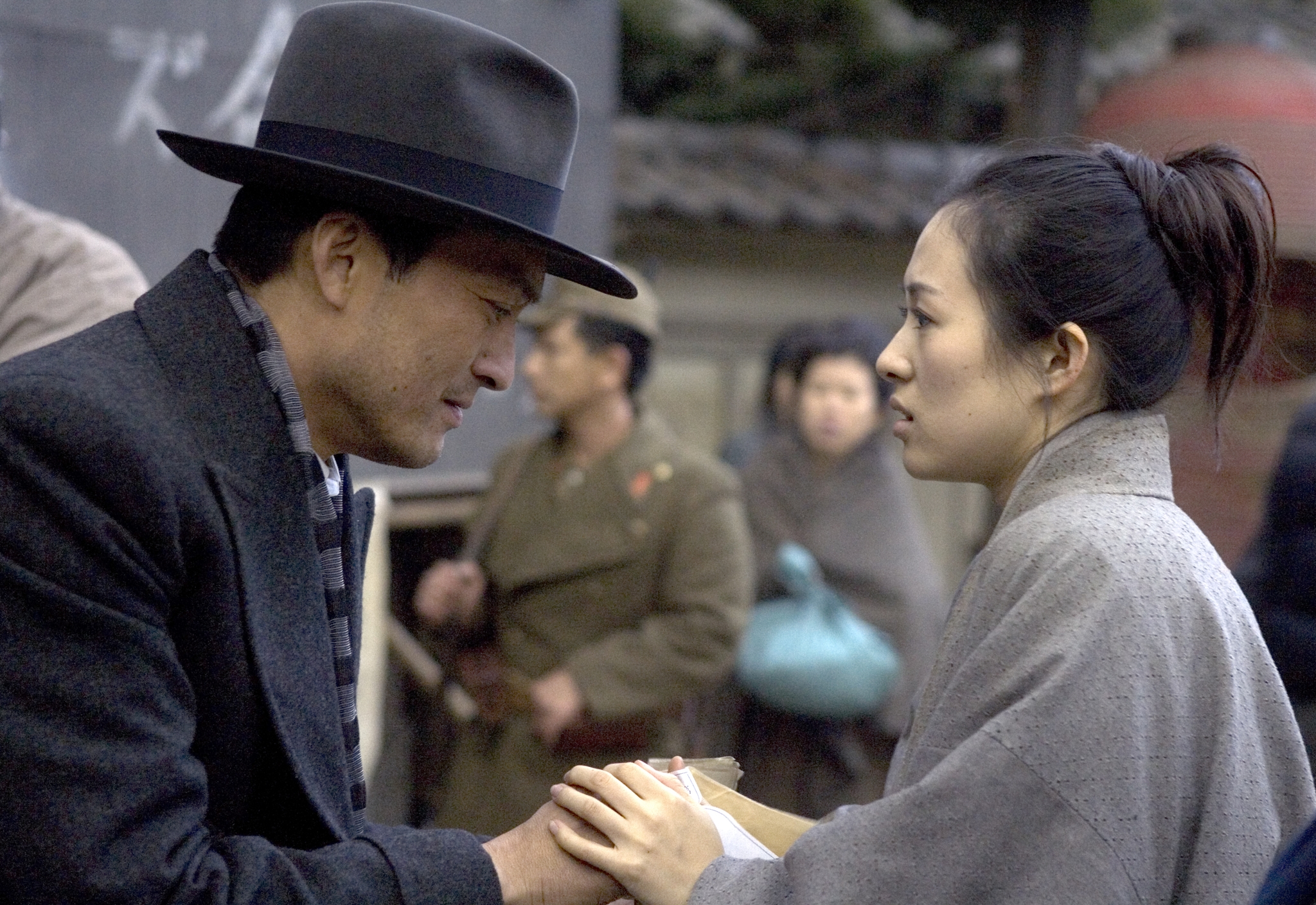 Prominent actors Ken Watanabe and Zhang Ziyi in a captivating scene.