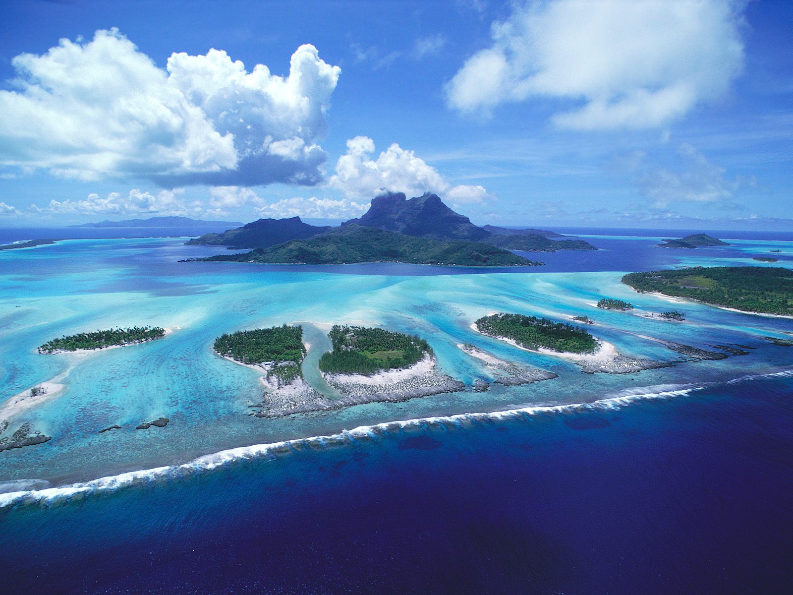 Bora-Bora, a stunning view of French Polynesia's turquoise waters and lush landscape.