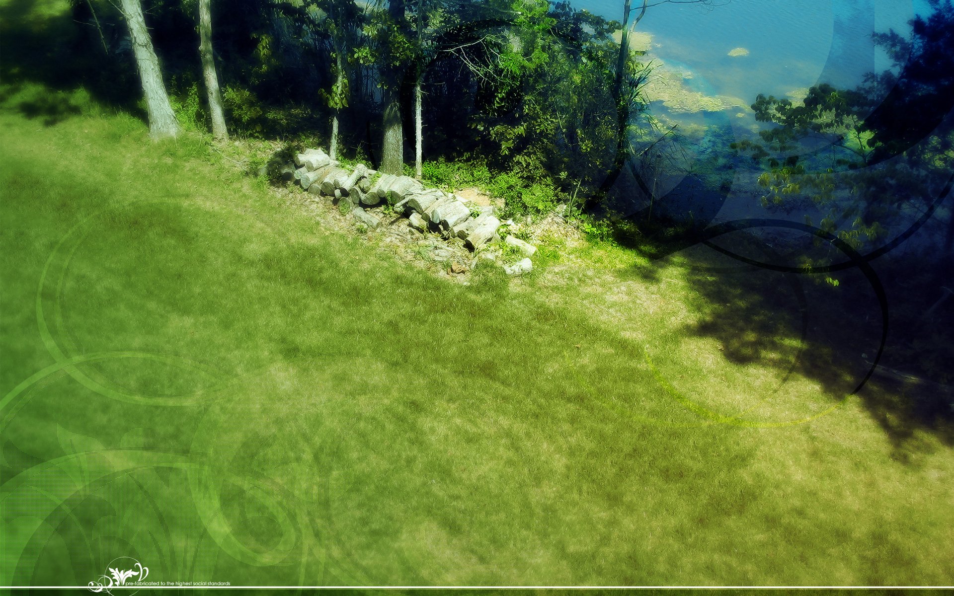 Artistic HD desktop wallpaper featuring a sunlit grassy field bordered by trees and a rustic stone wall, blending nature's tranquility with creative design.