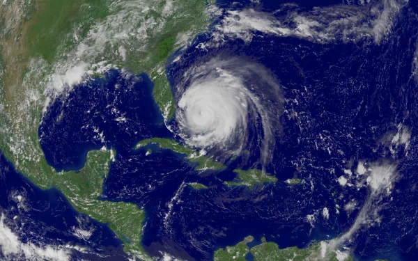 A stunning HD image of a hurricane captured from space, showcasing the swirling winds and vast ocean surrounding it, highlighting the power of nature on Earth.
