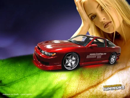 HD PC desktop wallpaper featuring a red sports car with detailed decals positioned on a vibrant green surface, alongside a contemplative blonde woman in the background.